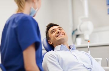 Man smiling in treatment chair at dentist in Tampa, FL 