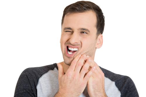 Man with bad tooth pain from periodontal disease