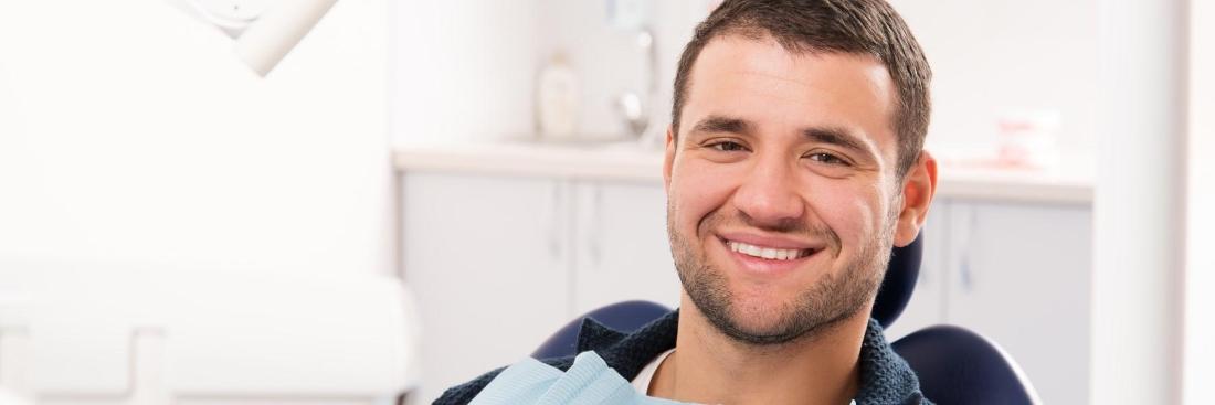 man smiling in dentist chair | Carrollwood, FL 33618