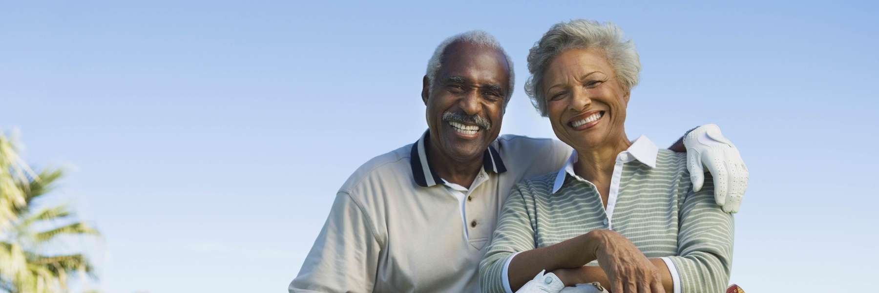 Couple with dentures smiling in North Tampa