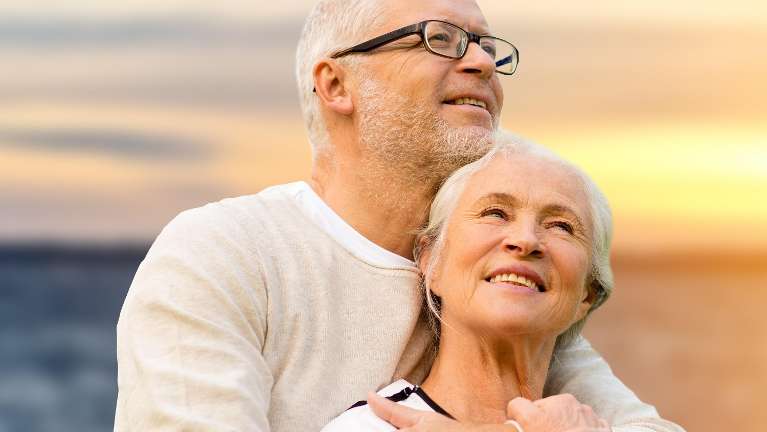 Couple with full dentures in North Tampa enjoying the sunset 