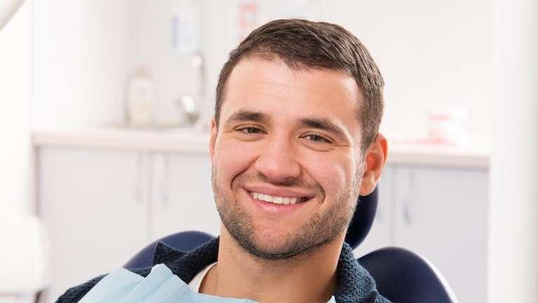 Patient smiling in treatment chair at dentist near me Tampa, FL